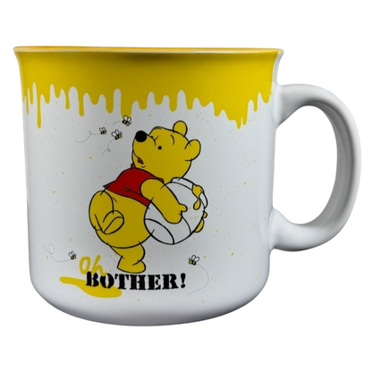 Disney collectible Winnie the Pooh mug with yellow honey drip design and Oh Bother quote