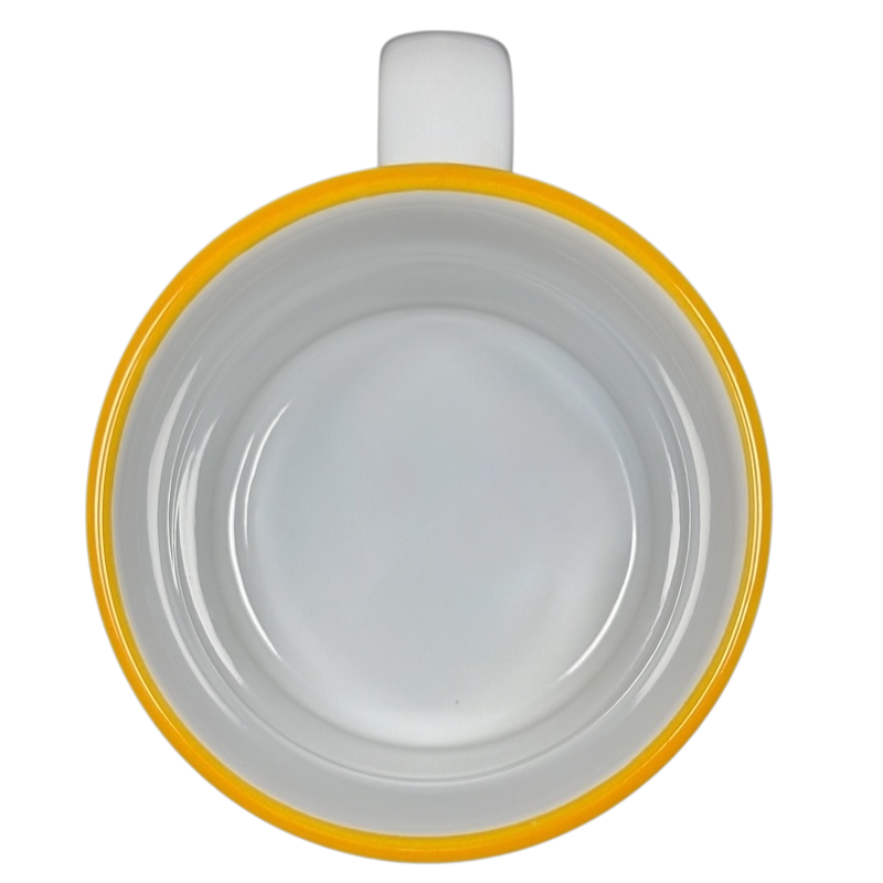 Top view of Disney collectible Winnie the Pooh mug with yellow rim and white interior