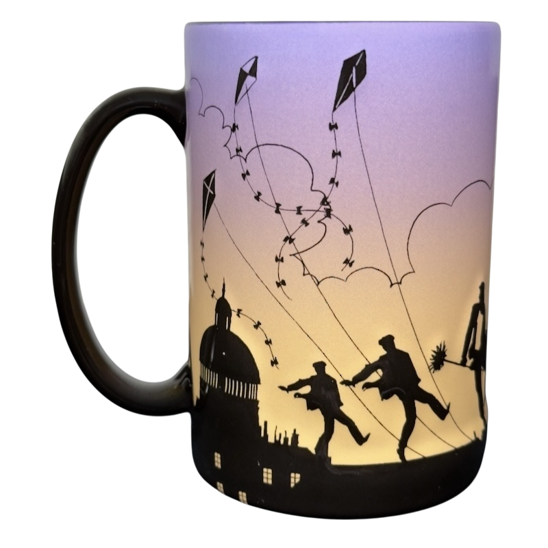 Disney Parks Mary Poppins silhouette vintage mug with black skyline and dancing figures with kites on purple to yellow gradient