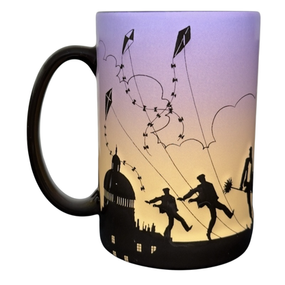 Disney Parks Mary Poppins silhouette vintage mug with black skyline and dancing figures with kites on purple to yellow gradient