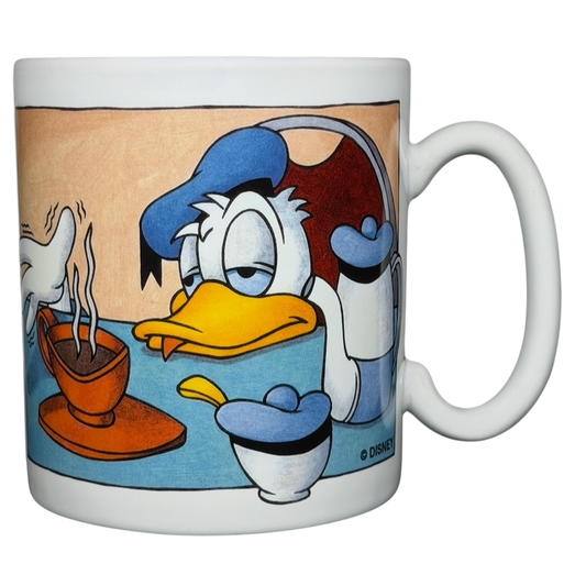 Donald Duck morning mood jumbo mug featuring Donald looking sleepy next to a steaming cup