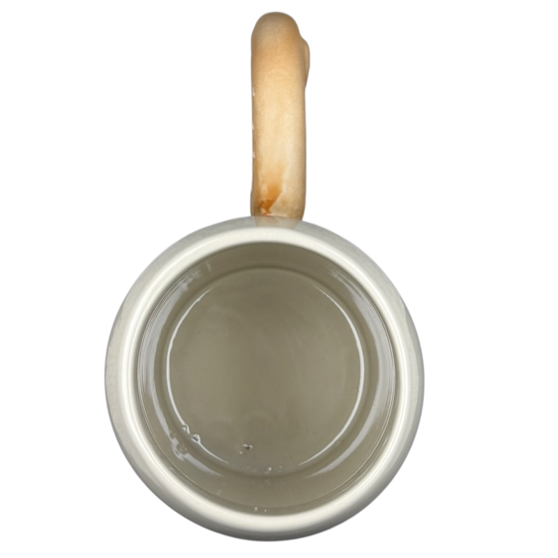 Disney Epcot Germany pretzel mug with a beige interior and a wooden handle design