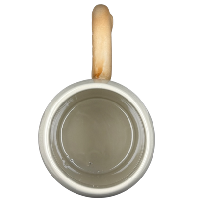 Disney Epcot Germany pretzel mug with a beige interior and a wooden handle design
