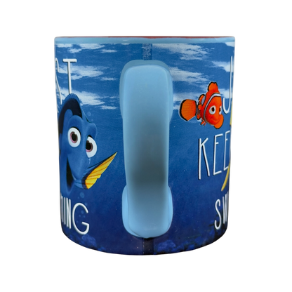 Finding Dory collectible Disney mug featuring Dory and Marlin with motivational quote