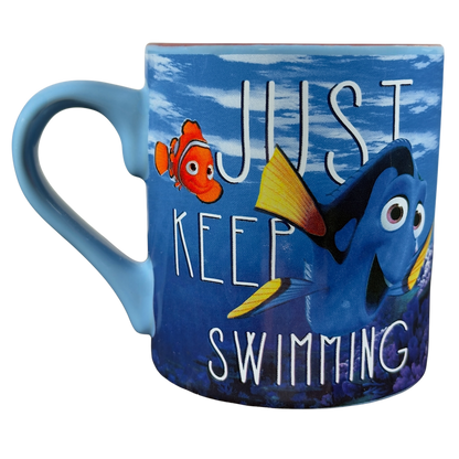 Finding Dory collectible Disney mug featuring Dory and Nemo with 'Just Keep Swimming' quote