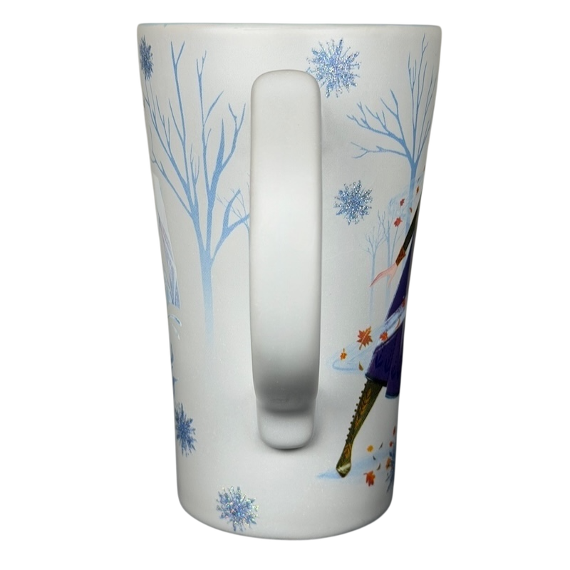 Disney Frozen Elsa and Anna mug featuring vibrant character designs and winter-themed graphics