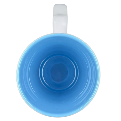 Disney Frozen Elsa and Anna mug featuring a vibrant blue interior for fans of the animated film