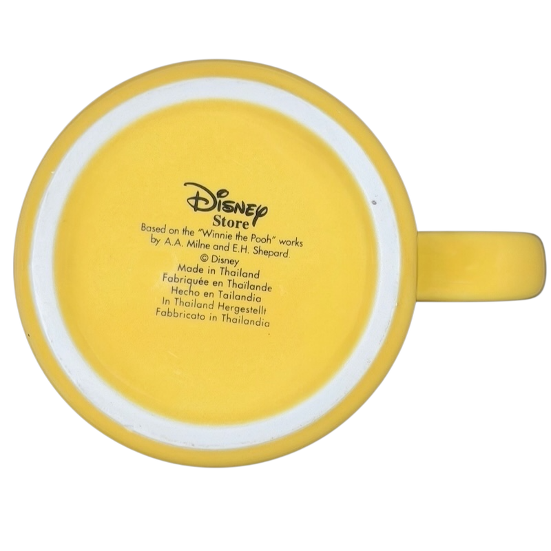 Disney Huggably Pooh embossed mug in bright yellow with a smooth handle, perfect for tea or coffee