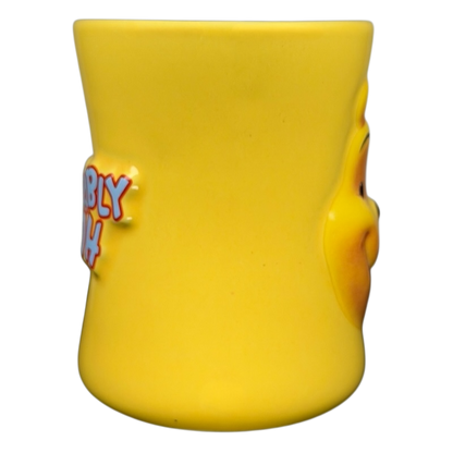 Disney Huggably Pooh embossed mug in bright yellow with character design on the side
