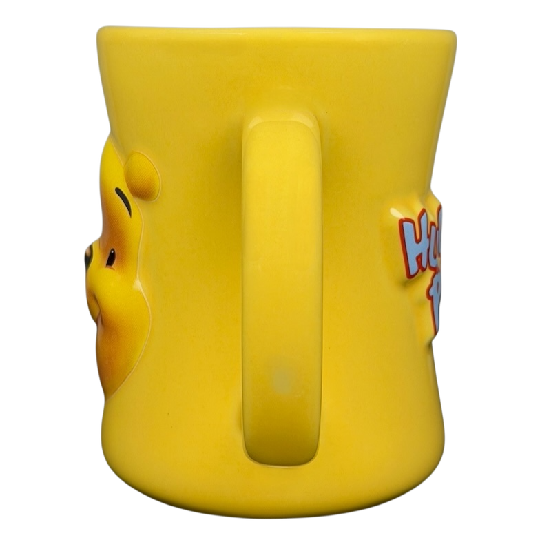 Disney Huggably Pooh embossed mug in bright yellow featuring the iconic Pooh Bear design