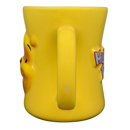 Disney Huggably Pooh embossed mug in bright yellow featuring the iconic Pooh Bear design