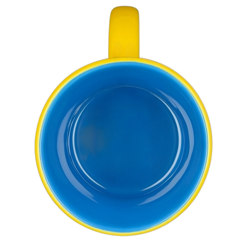 Disney Huggably Pooh embossed mug featuring a bright yellow exterior and blue interior design