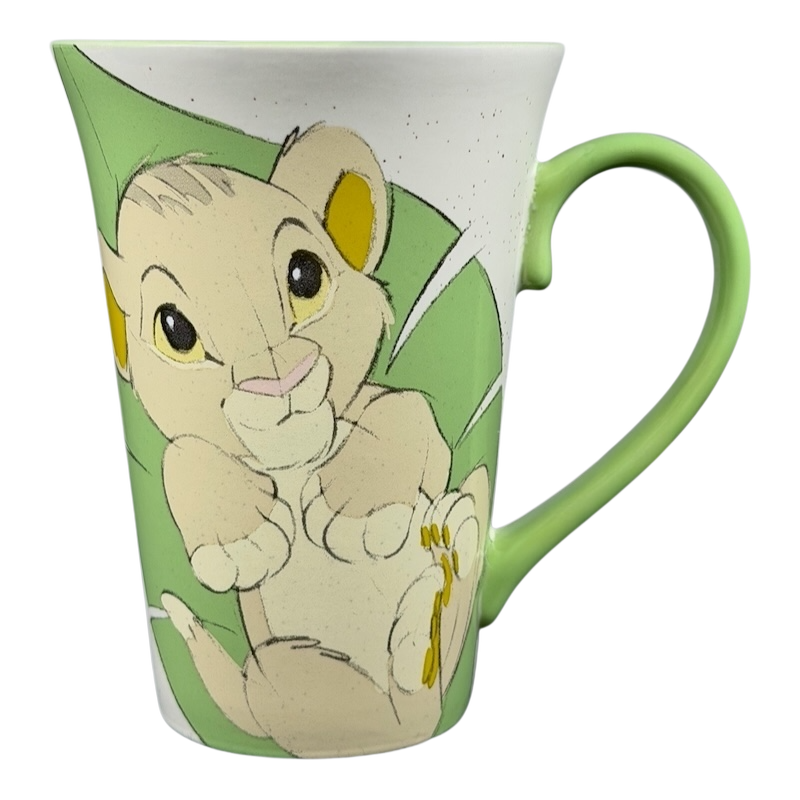 Disney Lion King Bay Simba Rafiki mug collectible with a cute Simba design on a green background