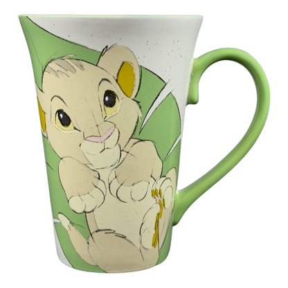 Disney Lion King Bay Simba Rafiki mug collectible with a cute Simba design on a green background