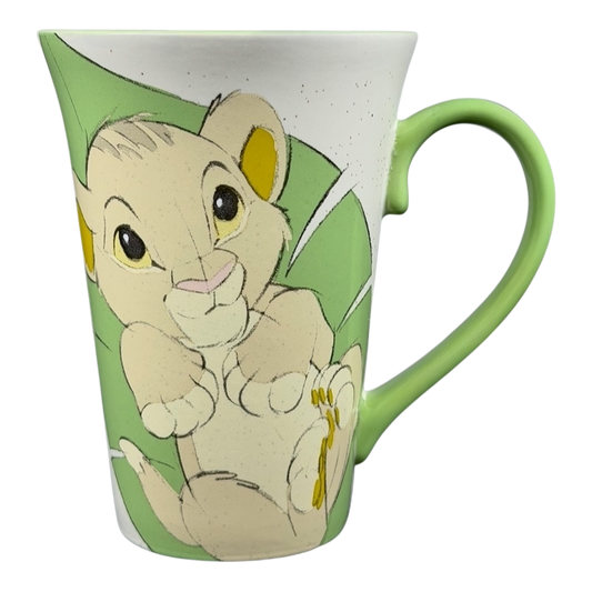 Disney Lion King Bay Simba Rafiki mug collectible with a cute Simba design on a green background