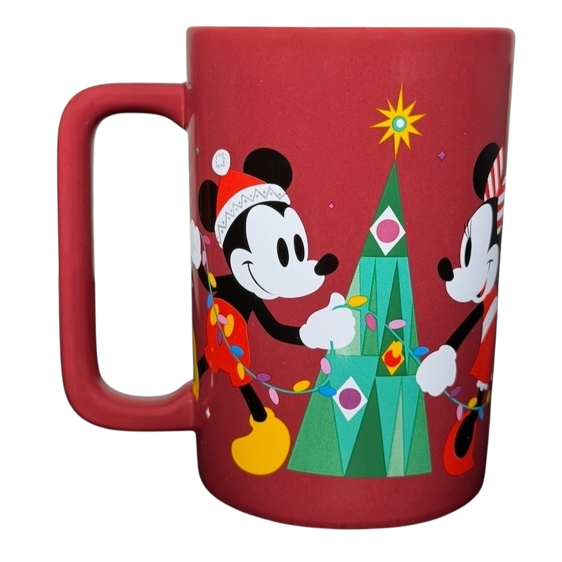 Disney Mickey and Friends holiday mug featuring Mickey and Minnie decorating a Christmas tree
