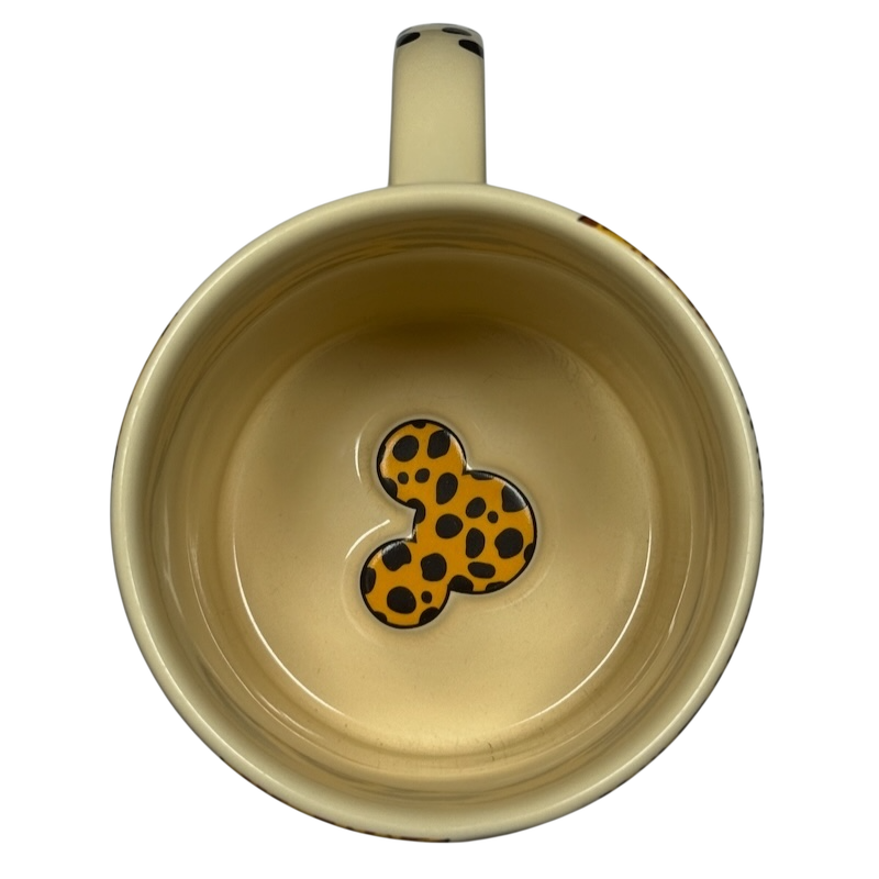 Top view of Disney Mickey Mouse vintage Animal Kingdom mug with spotted Mickey silhouette inside