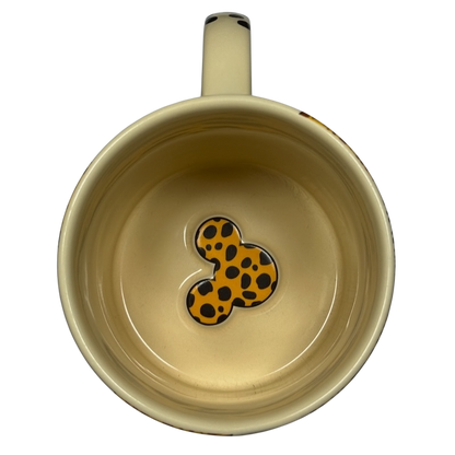 Top view of Disney Mickey Mouse vintage Animal Kingdom mug with spotted Mickey silhouette inside
