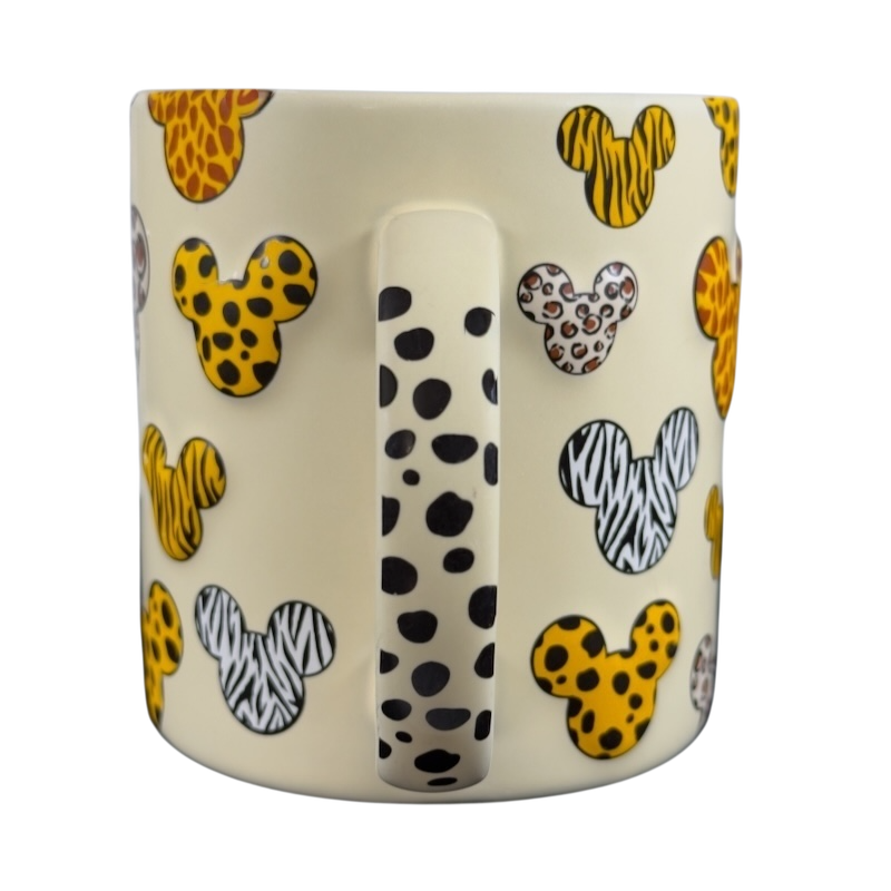 Disney Mickey Mouse vintage Animal Kingdom mug with animal print Mickey head designs on cream background