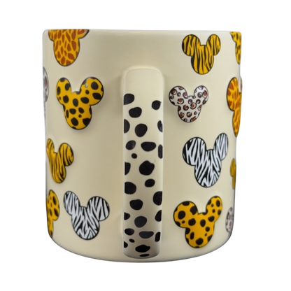 Disney Mickey Mouse vintage Animal Kingdom mug with animal print Mickey head designs on cream background