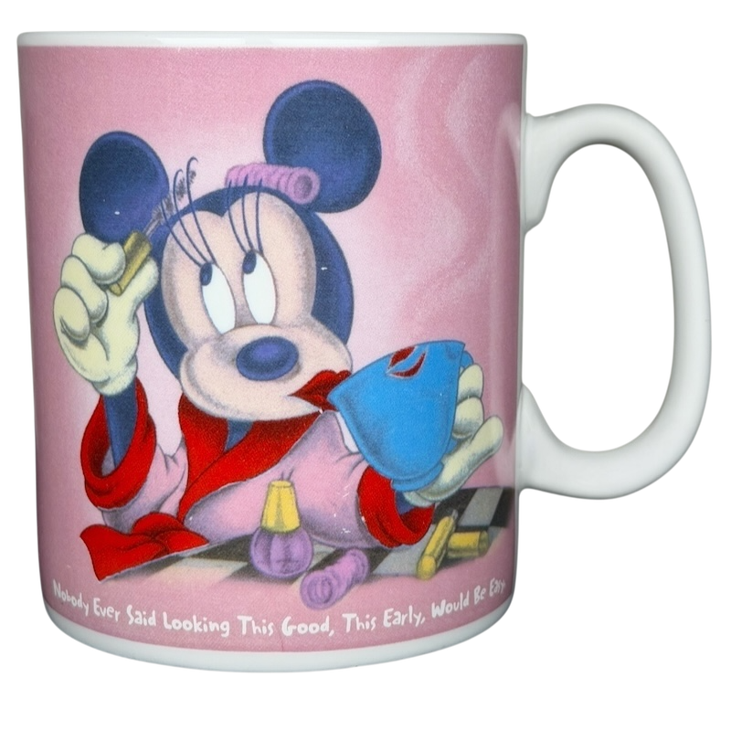 Disney Minnie Mouse jumbo mug featuring Minnie in a robe with beauty products and a playful expression