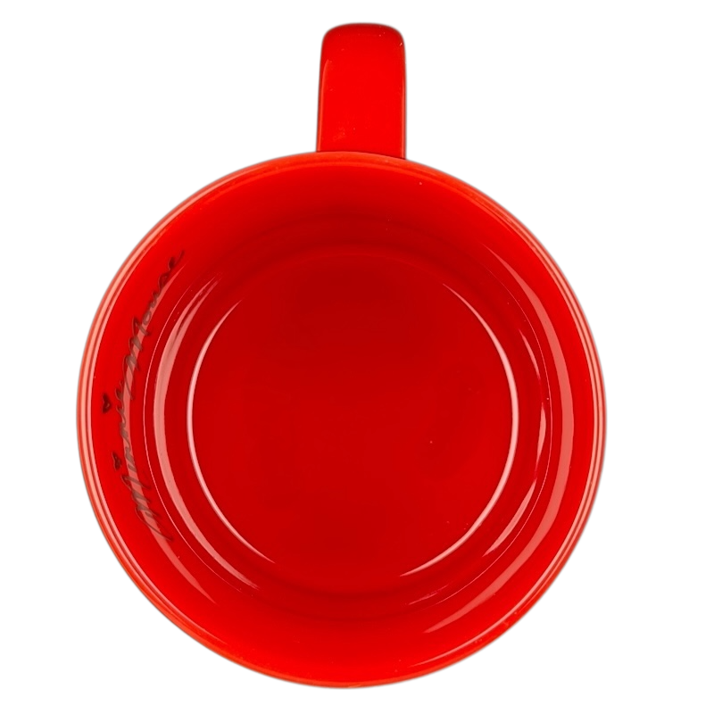 Top view of a red mug showcasing Disney's Minnie Mouse polka dot bow collectible mug design