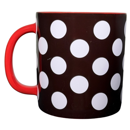 Minnie Mouse polka dot bow collectible mug featuring a red handle and bold white dots on a dark background