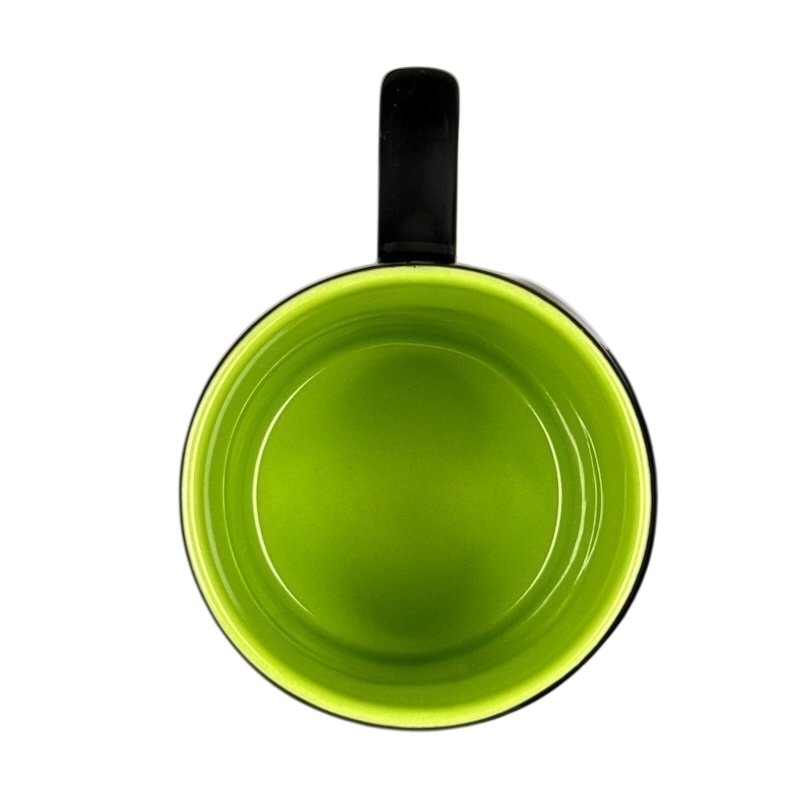 Top view of Disney Villains collectible mug with glossy lime green interior and black handle