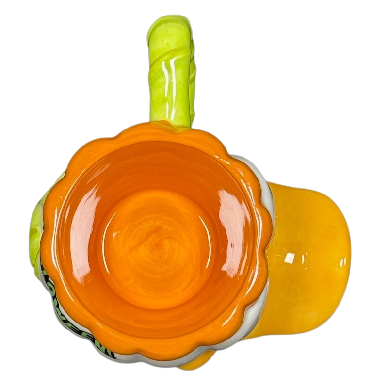 Donald Duck vintage Halloween mug top view showing orange scalloped interior and green handle by Disney