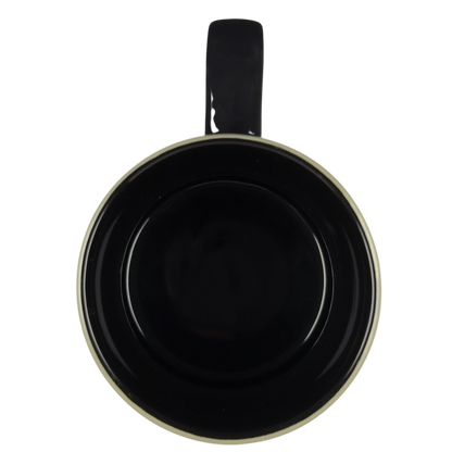 Top view of Grumpy Disney vintage collectible mug showing black interior cream rim and single handle