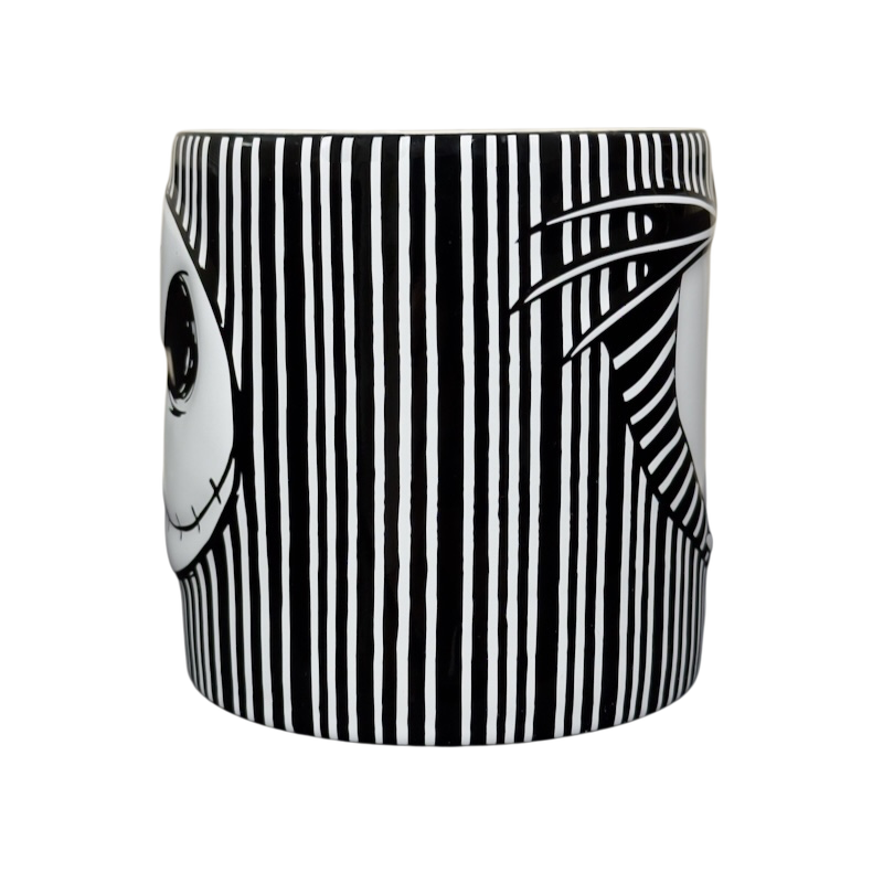 Black and white striped ceramic Jack Skellington embossed Disney collectible mug with partial face and pinstripe design
