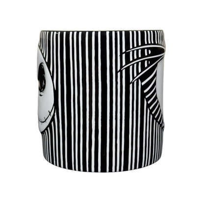 Black and white striped ceramic Jack Skellington embossed Disney collectible mug with partial face and pinstripe design