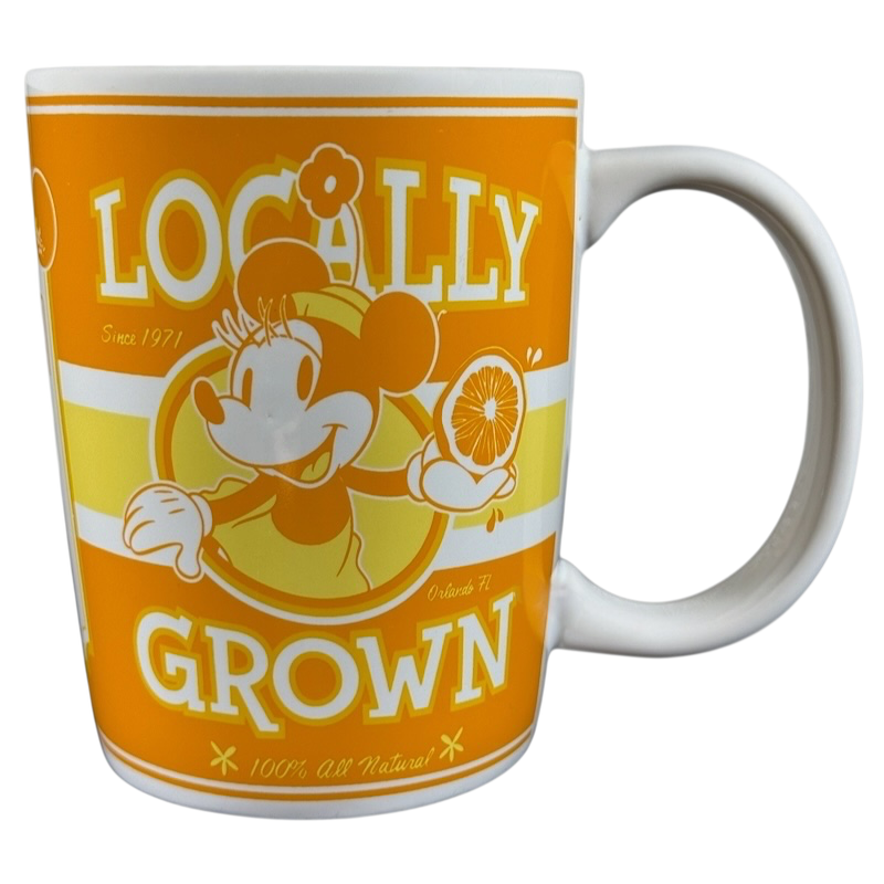 Disney Parks locally grown vintage mug featuring retro Mickey Mouse holding an orange slice