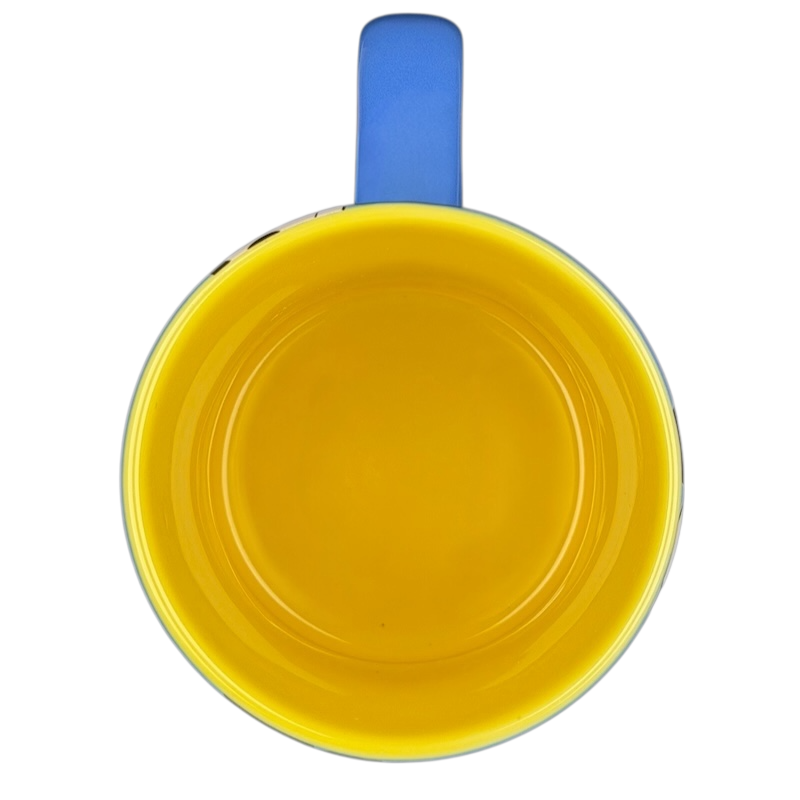 Top view of Mickey Mouse collectible Glitter Mug Disney Parks in bright yellow and blue colors