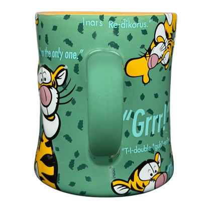 Tigger T.T.F.N. Glitter Collectible Mug Disney Parks featuring colorful Tigger designs on a teal background