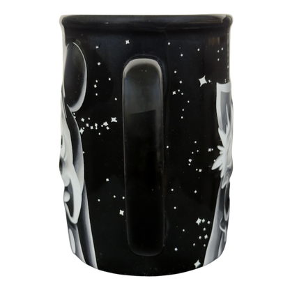 Twilight Zone Tower of Terror Disney collectible mug black ceramic with starry background and white ghosts and handle visible