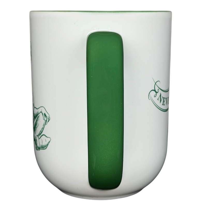 Peter Pan Never Grow Up Disney mug featuring a green handle and whimsical designs