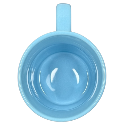 Top view of Disney Peter Pan Think of the Happiest Things mug in sky blue showing ceramic interior and handle