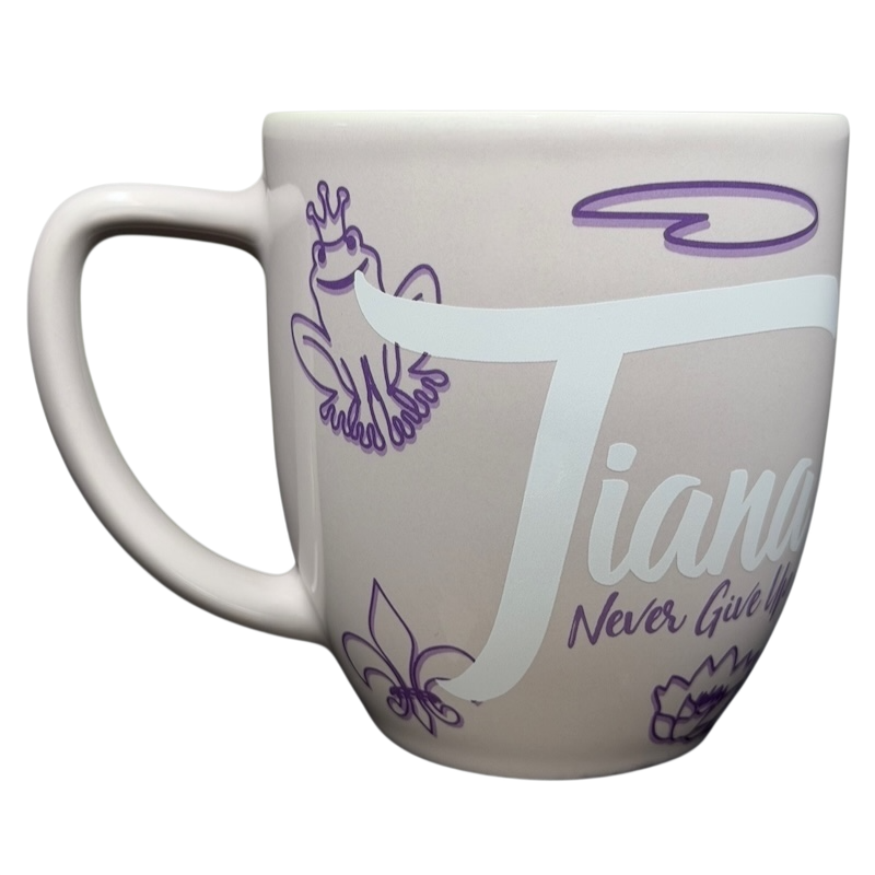 Princess Tiana Never Give Up Mug Disney Parks featuring a pastel design with Tiana and frog illustrations