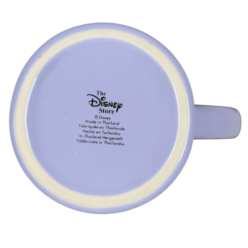 Bottom view of pale lavender Disney Tinker Bell stuck in keyhole vintage mug showing Disney Store logo and side handle