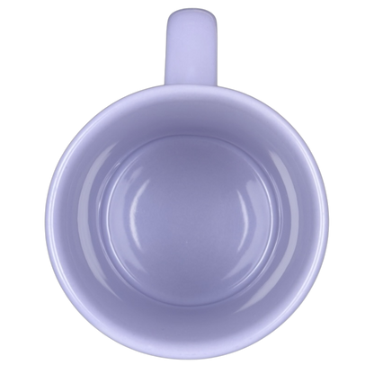 Top view of empty lavender Disney Tinker Bell stuck in keyhole vintage mug on black background