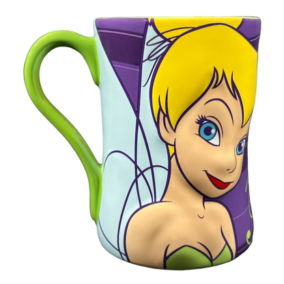 Disney Tinker Bell vintage mug showing closeup of Tinker Bell face with green handle and purple background