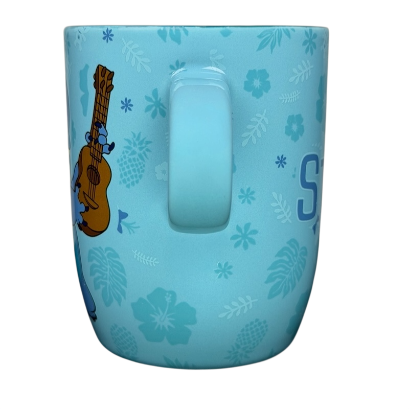 Stitch Ukulele Mug Flower Disney Store featuring Stitch with floral designs on a blue background