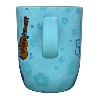 Stitch Ukulele Mug Flower Disney Store featuring Stitch with floral designs on a blue background