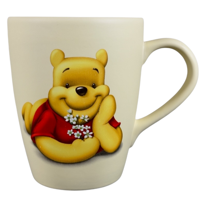 Disney vintage Winnie the Pooh flowers coffee cup with Pooh holding white flowers in red shirt
