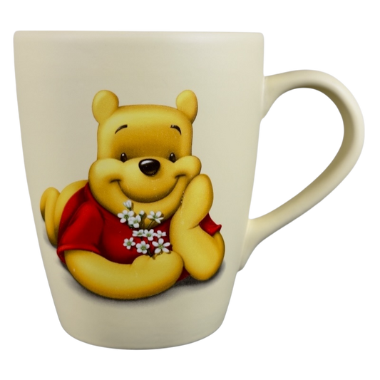 Disney vintage Winnie the Pooh flowers coffee cup with Pooh holding white flowers in red shirt