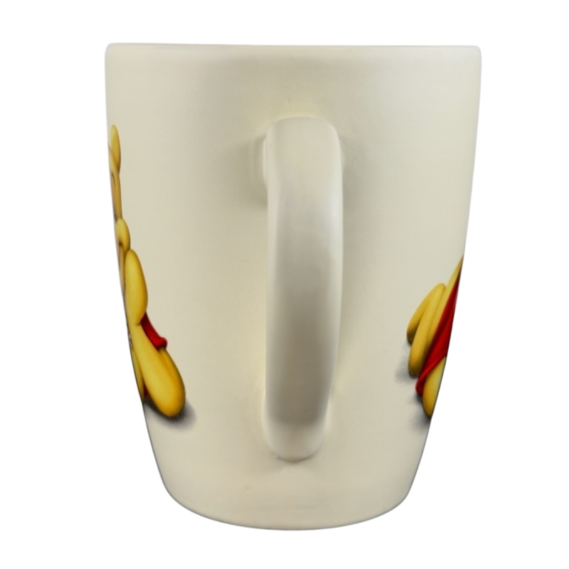 Vintage Winnie the Pooh flowers coffee cup by Disney featuring classic Pooh design with a white handle