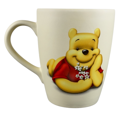 Disney vintage Winnie the Pooh flowers coffee cup featuring Pooh holding white flowers and smiling
