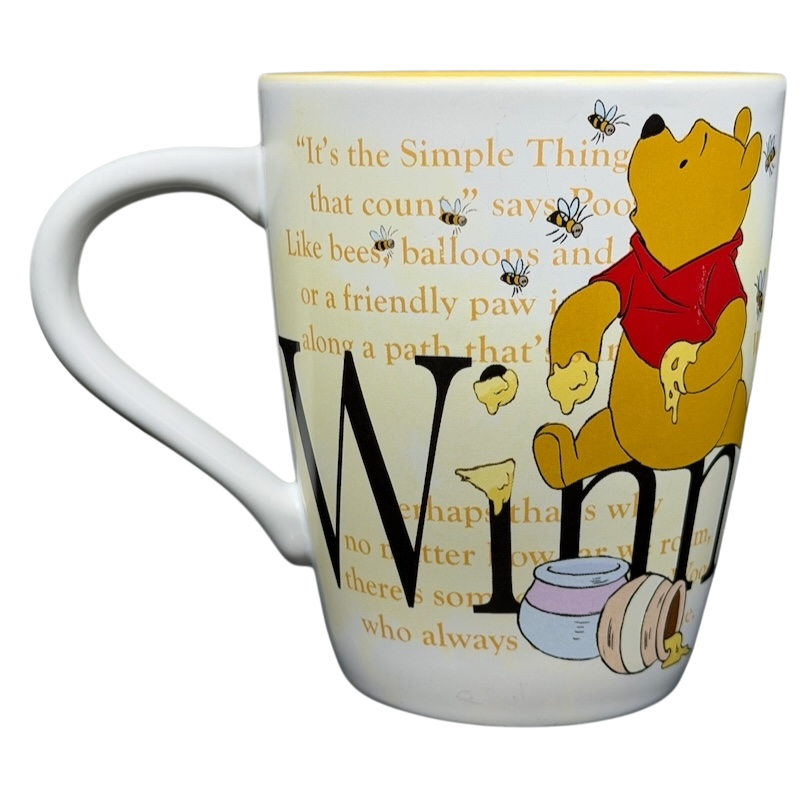 Winnie the Pooh Storybook Mug Disney Store featuring Pooh, honey, and inspirational quote designs
