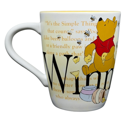 Winnie the Pooh Storybook Mug Disney Store featuring Pooh, honey, and inspirational quote designs